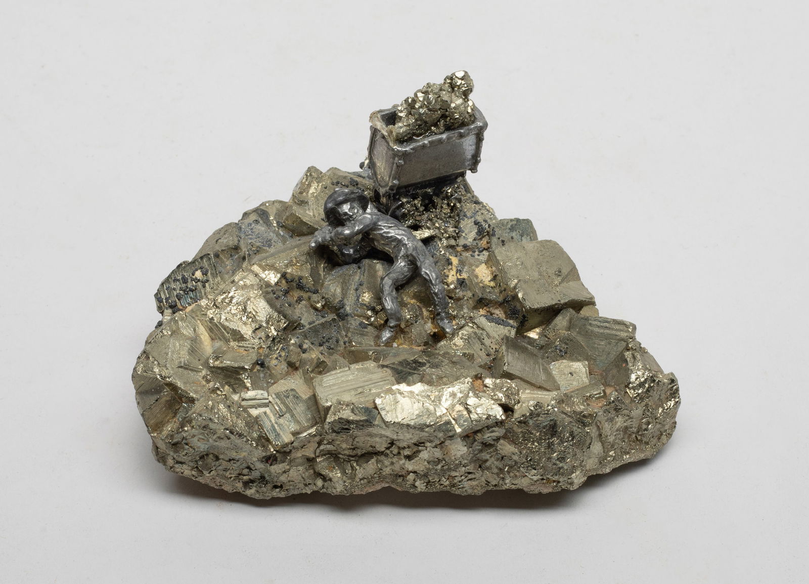 Vintage Mine Stone Sculpture: Collectible mine stone sculpture, carved with a miner holding a sickle. Approx. 3.6*3.8*2.3 inch. The Estate of the Store Closed Sale, Los Angeles.