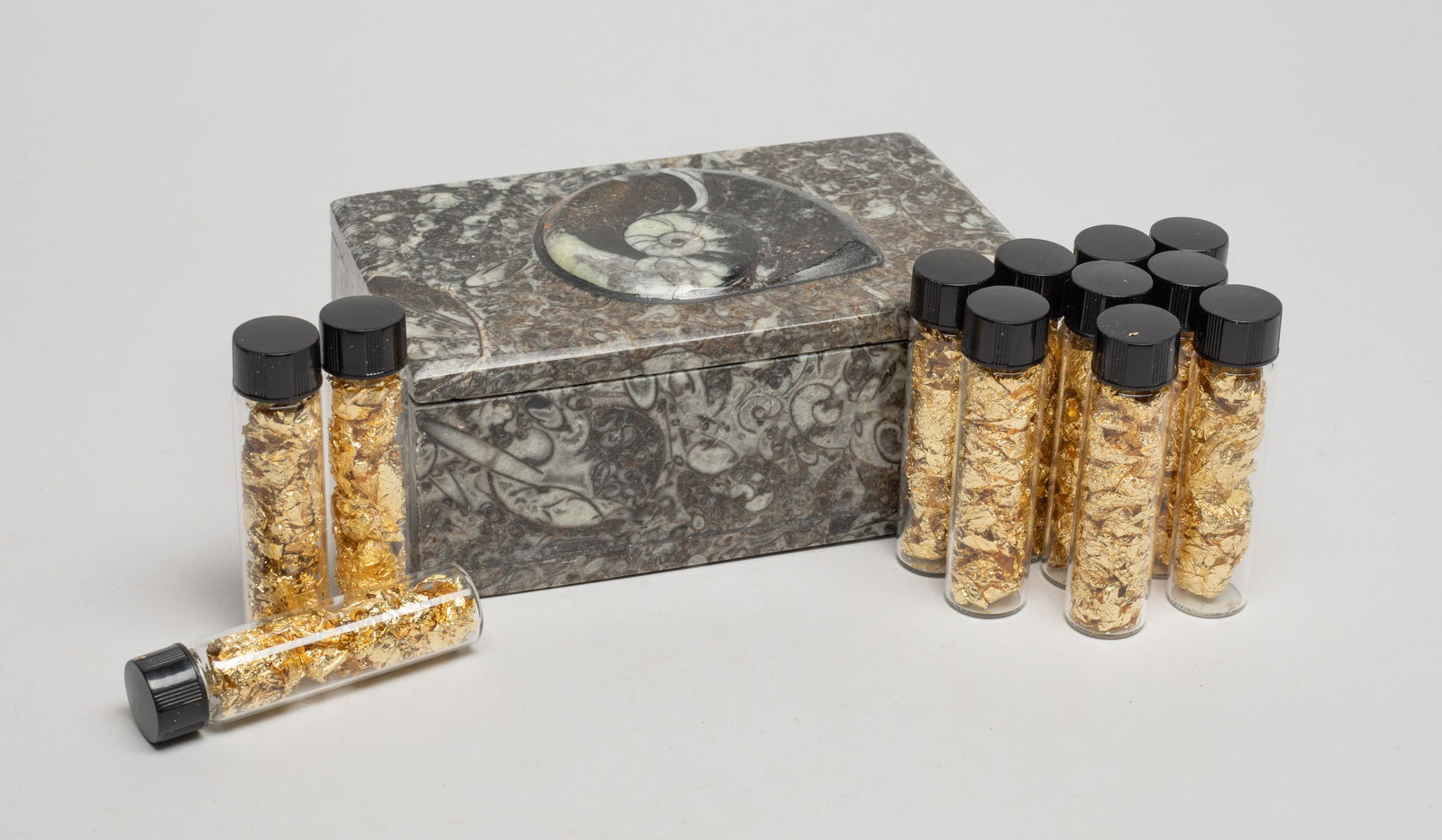 Gold Leaf w/ Fossil Box: Large set of vials of gold leaf, with a fossil carved covered box. Approx. 5.07*3.16*2.15 inch (box size).