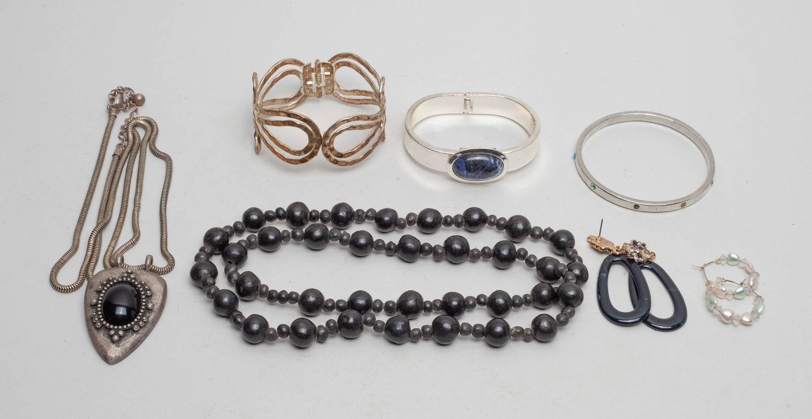 High Quality Designed Costume Jewelry: Including 3 cuff bangles, 2 pairs of earrings, a bead necklace and a long chain necklace. Approx. 30inch L (largest).