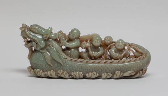 Large Chinese Jade Carved Table Sculpture: Skillfully carved as three happy boys on a dragon boat over raging waves, the first boy grabbing the dragon horns, the middle boy holding a long stem with lotus leaf, the other boy holding a stem issu
