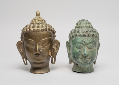 Two Asian Bronze Buddha Head Sculptures
