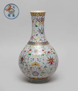 Chinese Export Porcelain Lamp Vase: The pear-shaped body rising from a short splayed foot to a gently waisted neck, the exterior enameled with dense lotus scrolls, interspersed with bats and instruments, the bottom pierced with an apert