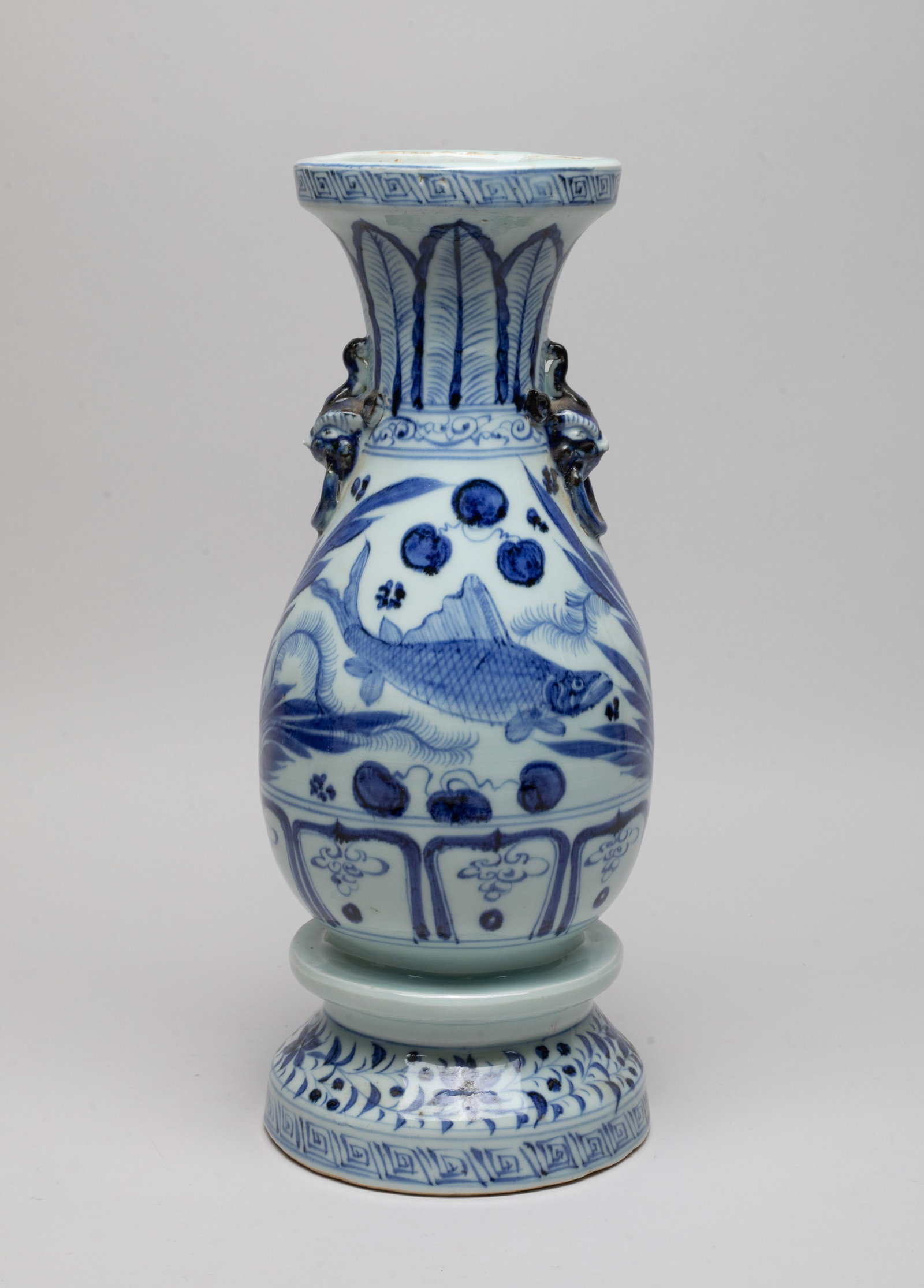 Estate Chinese Shipwreck Type Porcelain Vase: The vase body painted with fish swimming amidst water plants, below a band of upright leaves, above a band of petals, flanked by a pair of faux-ring mask handles, the foot with a band of foliage. Appr