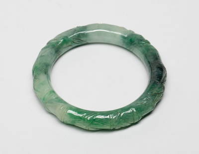 Chinese Bamboo Form Bangle: Chinese jade-like stone bangle, carved in bamboo form. Approx. 3.65 inch outer diameter, 2.65 inch inner diameter.