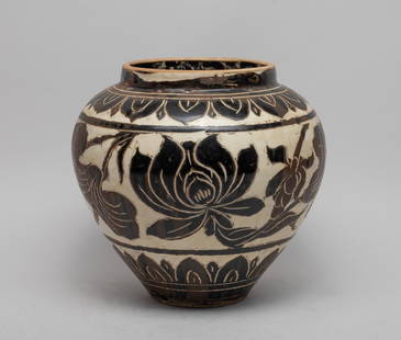 Chinese Cizhou Type Porcelain Large Jar: The jar exterior carved with a wide band of stylized lotus between bands of overlapping lotus petals, applied with cream and black glaze. Approx. 9*8.5 inch.