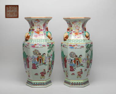 Two Chinese Export Porcelain Vases: Of hexagonal section, the baluster body rising from a splayed foot to a waisted neck with a flared rim, set with a pair of raised peaches as handles, the exterior enameled and painted with a mythical