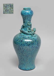 Chinese Flambe Glazed Porcelain Vase: The ovoid body rising from a splayed foot to a waisted neck with a garlic mouth, flanked by a raised sinuous chilong, the exterior covered with crackled turquoise glaze suffused with dark-blue streaks
