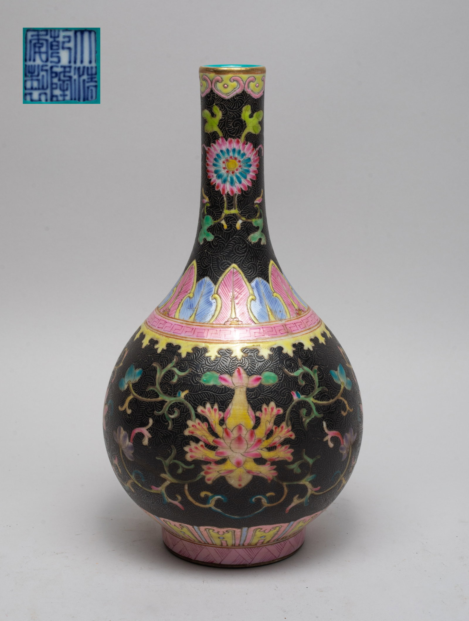 Estate Chinese Porcelain Decor Vase: The vase body decorated with lotus between bands of leaves and lappets, the neck with flowers between bands of ruyi heads and leaves, all against black glazed scroll background, the interior and botto