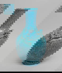 Chinese Flambe Glazed Porcelain Vase: Of lobed form, the ovoid body rising from a short foot to a columnar neck, carved in high relief with a chilong, overall covered with crackled turquoise glaze suffused with dark blue streaks, the bott