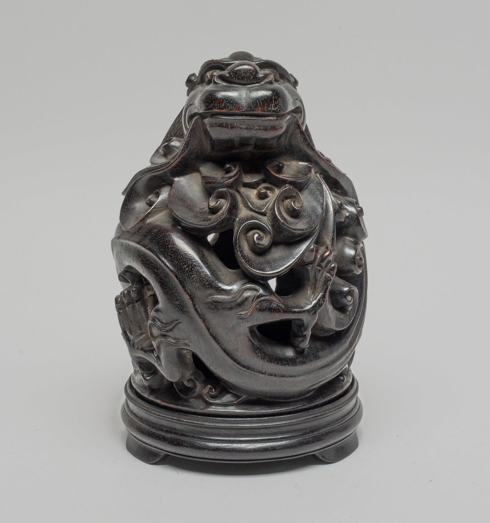 Estate Chinese Wood Carved Censer: Deftly carved in openwork with a mythical single-horned beast sinuous amidst cloud scrolls, with a circular wood base. Approx. 6.3*4 inch.