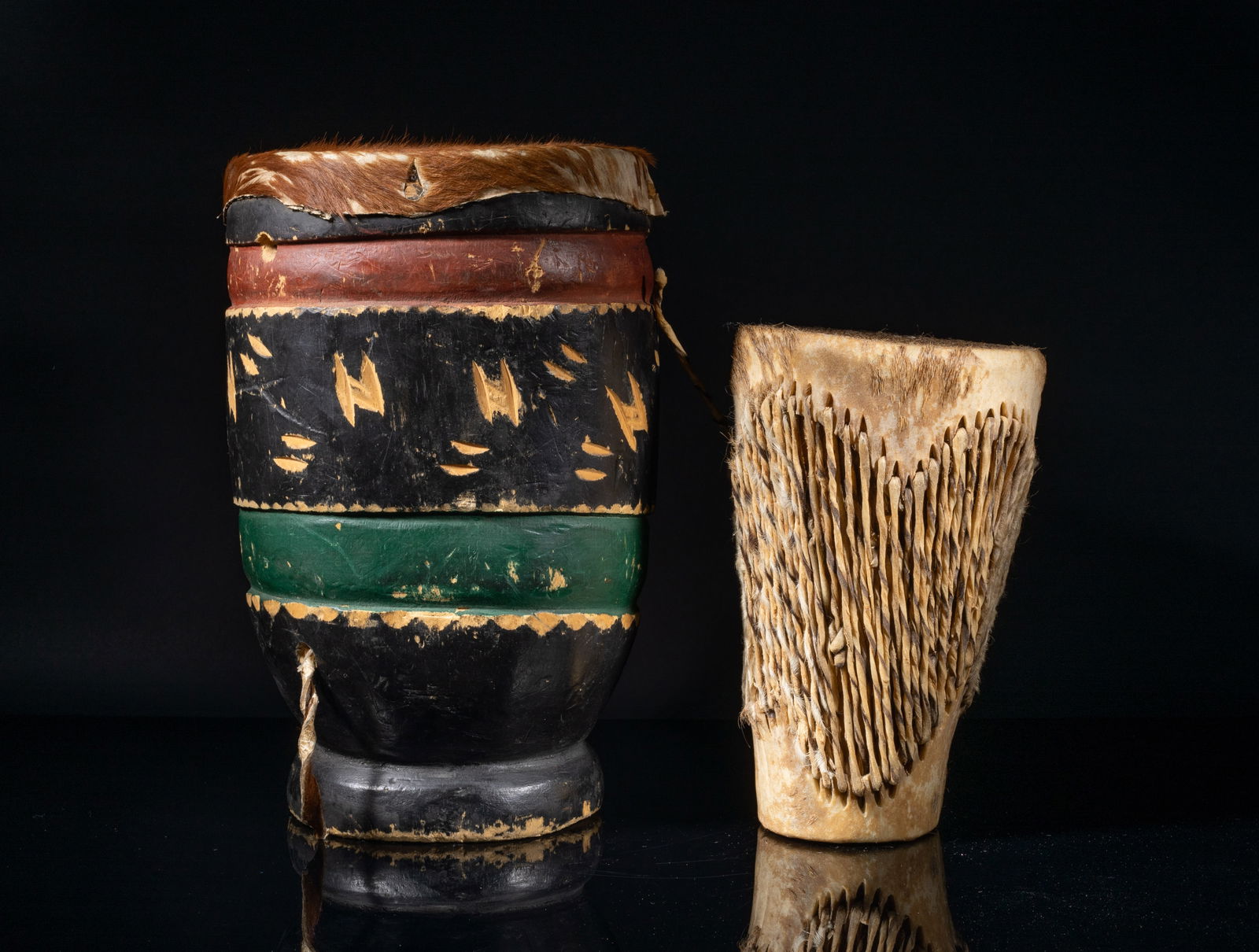 Two African Old Leather Drums: Two African style old leather drums. Approx. 12.2*7.7 inch (larger).