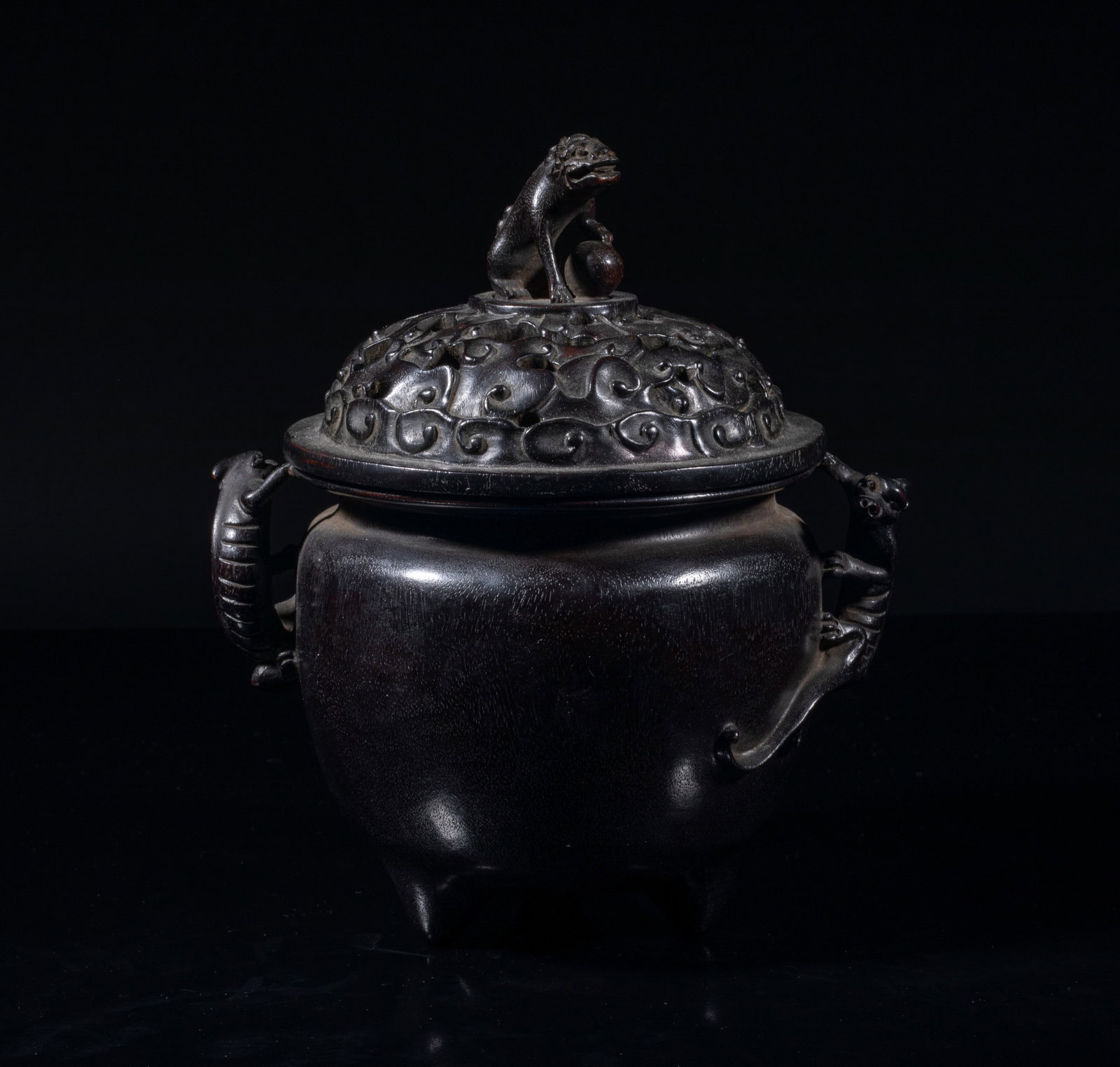 Rare Chinese Zitan Like Wood Censer: The ovoid body resting on three short tapered feet, carved in high relief with a pair of chilong forming as handles, the openwork lid carved with scrolling clouds and set with a beast as finial, the f