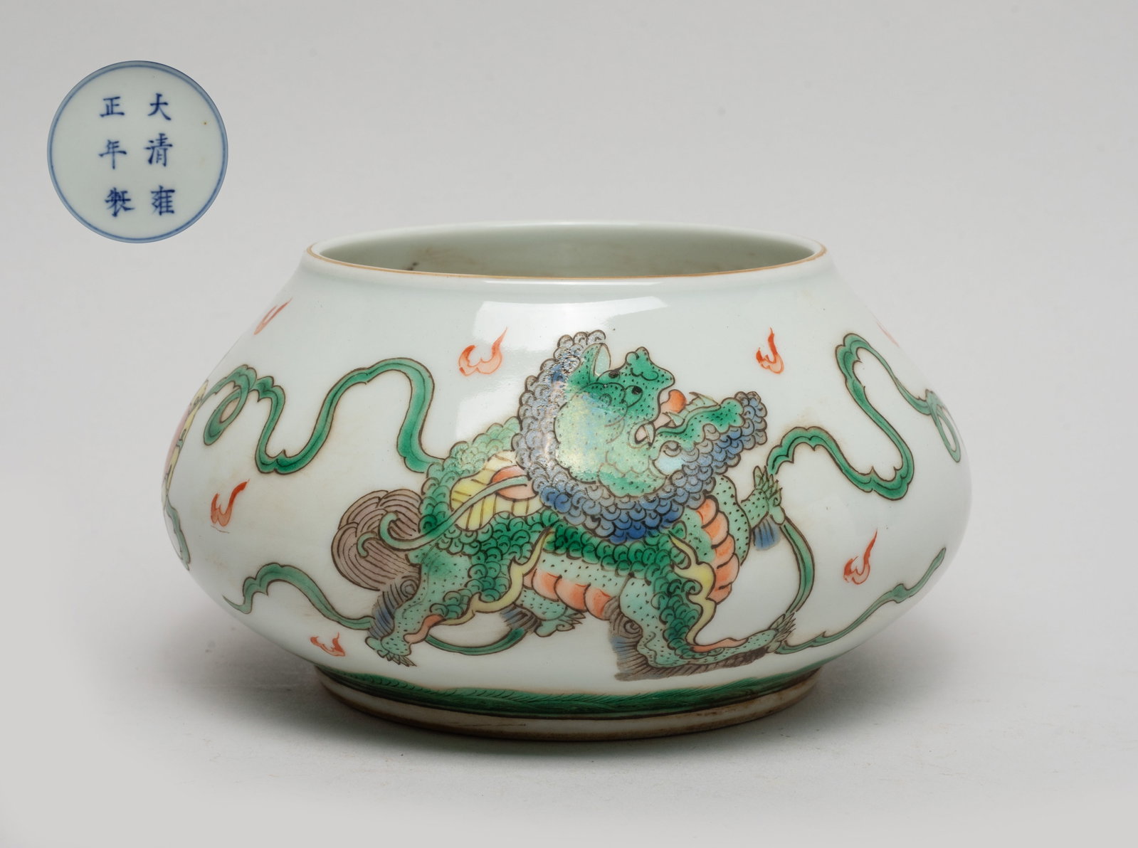 Estate Chinese Porcelain Water Pot: The water pot exterior decorated with a pair of qilin playing with a beribboned ball amid flames above waves, the bottom marked with six characters enclosed in double circles. Approx. 5.5*3 inch.