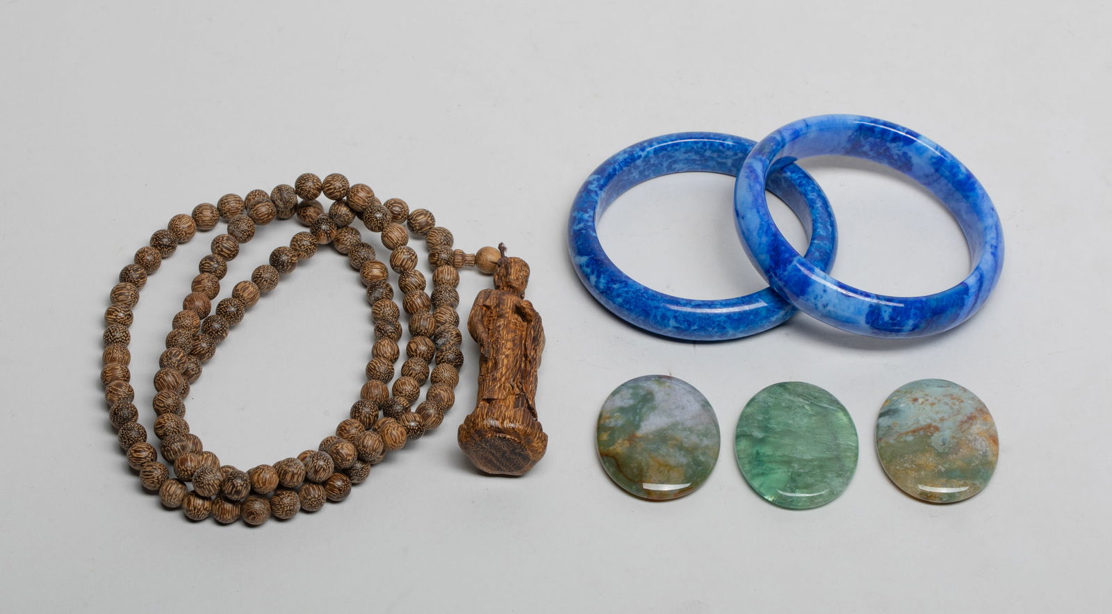 Chinese Agarwood, Agate Snuff Dishes/Bangles: Including two stone bangles, three agate carved snuff dishes, and an agarwood bead necklace, suspended with a Buddha pendant with left hand holding a bowl. Approx. 33 inch L (necklace length).