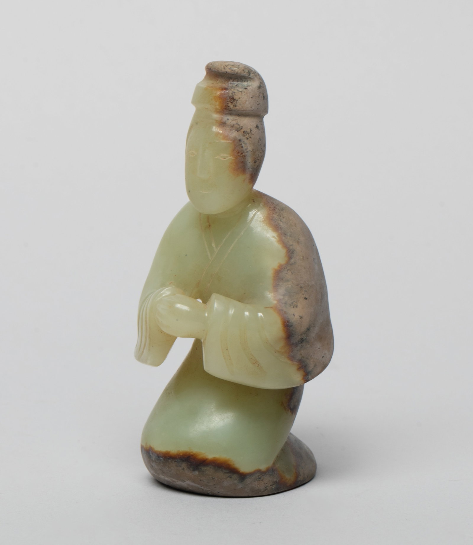 Chinese Russet Jade Figure: Collectible Chinese russet jade sculpture carved as a figure kneeling down, the hands folded in front of chest. Approx. 3.3*1.75*1.7 inch.