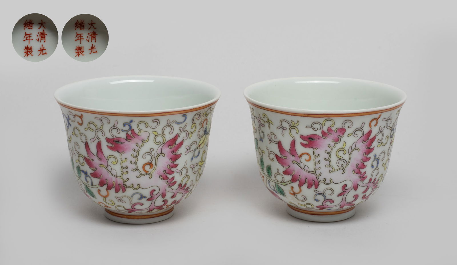 Two Chinese Export Porcelain Tea Cups: Each cup exterior enameled and painted with phoenix amidst lotus foliage, the bottom marked with six characters in copper-red. Approx. 3.07*2.35 inch (each).