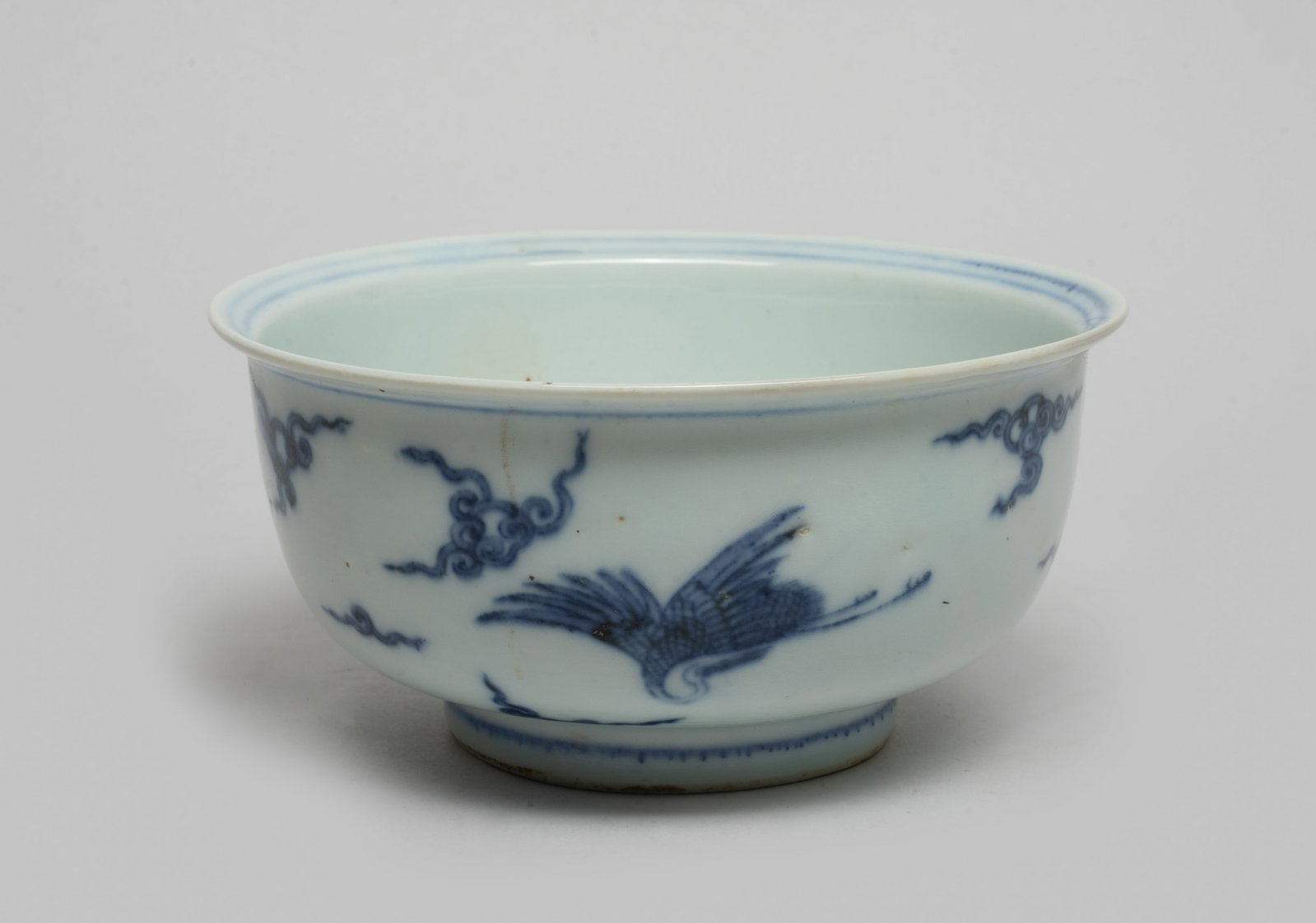 Chinese Blue & White Porcelain Bowl: The bowl interior centre painted with boys playing game, the exterior with cranes flying amongst scrolling clouds. Approx. 5.9*2.9 inch.