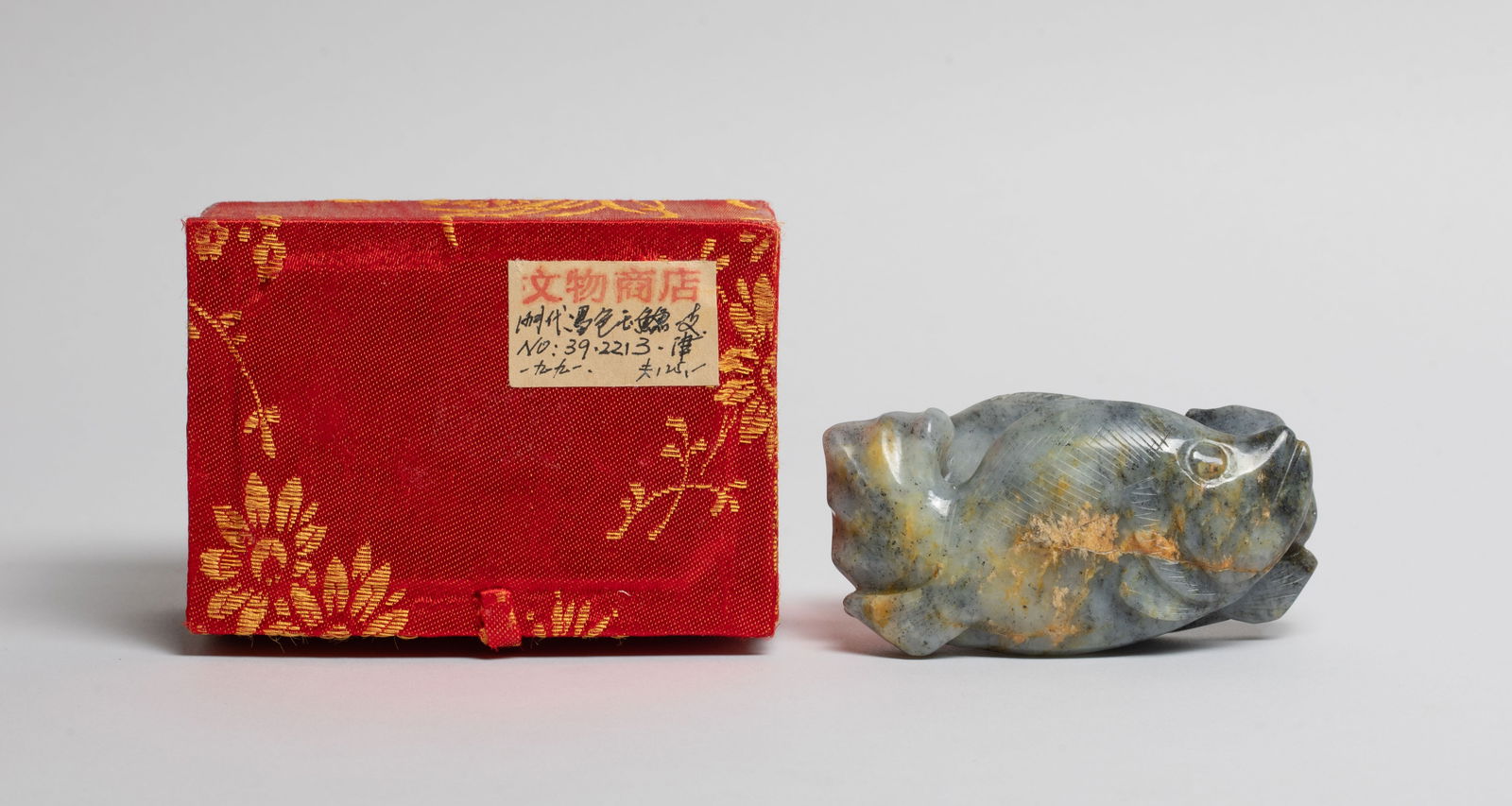 Chinese Black & White Jade Pendant of Fish: Deftly carved as a pair of fish close to each other, drilled through the centre for suspension, with box. Approx. 3.2*1.8*1.1 inch (w/o box). The Estate of the Store Closed Sale, SF