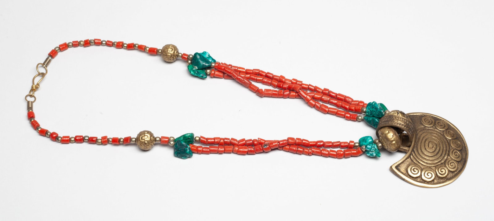 Estate Chinese Tibetan Long Necklace: Chinese Tibetan type long necklace, suspended with metal pendant carved with spirals. Approx. 22 inch L.