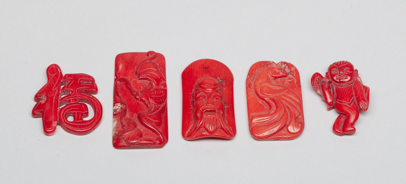 Estate Vintage Chinese Export Pendants: Group of five Chinese pendants, carved with Fu character, bird, boy, Shoulao, or bat holding a string of coins. Approx. 1.62*0.8 inch (largest).