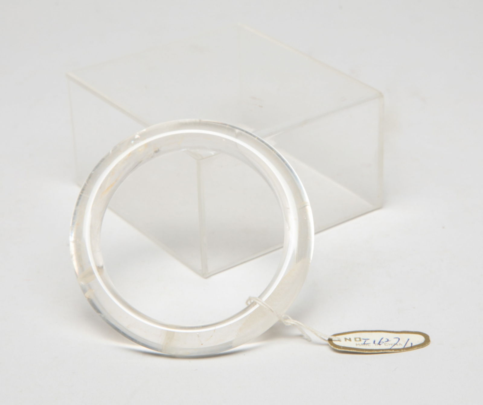 Estate Chinese Rock Crystal Bangle: Collectible Chinese rock crystal carved bangle. Approx. 3.05 inch outer diameter, 2.3 inch inner diameter.