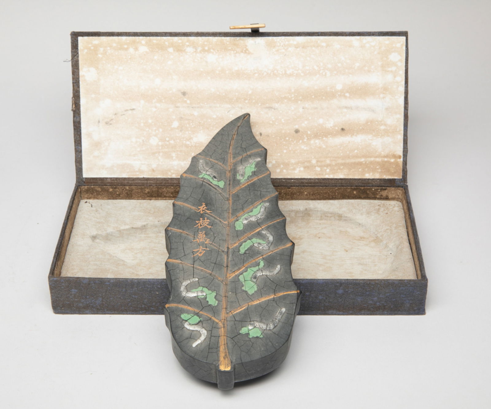 Large Chinese Ink Piece: Rare Chinese ink piece moulded in leaf form, both sides carved with silkworms eating mulberry leaves, inscribed with related passages, with a box. Approx. 9.8*3.9*1 inch (w/o box).