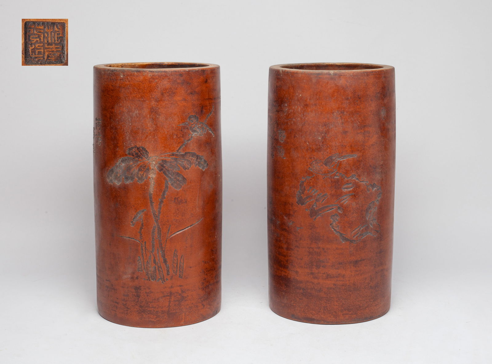 Two Tall Chinese Zisha Clay Vases: One carved with a bird on rocks, the other carved with a bird on leafy stems, both inscribed with related poems, with seal mark on the cylindrical body bottom. Approx. 11*5.5 inch (each).