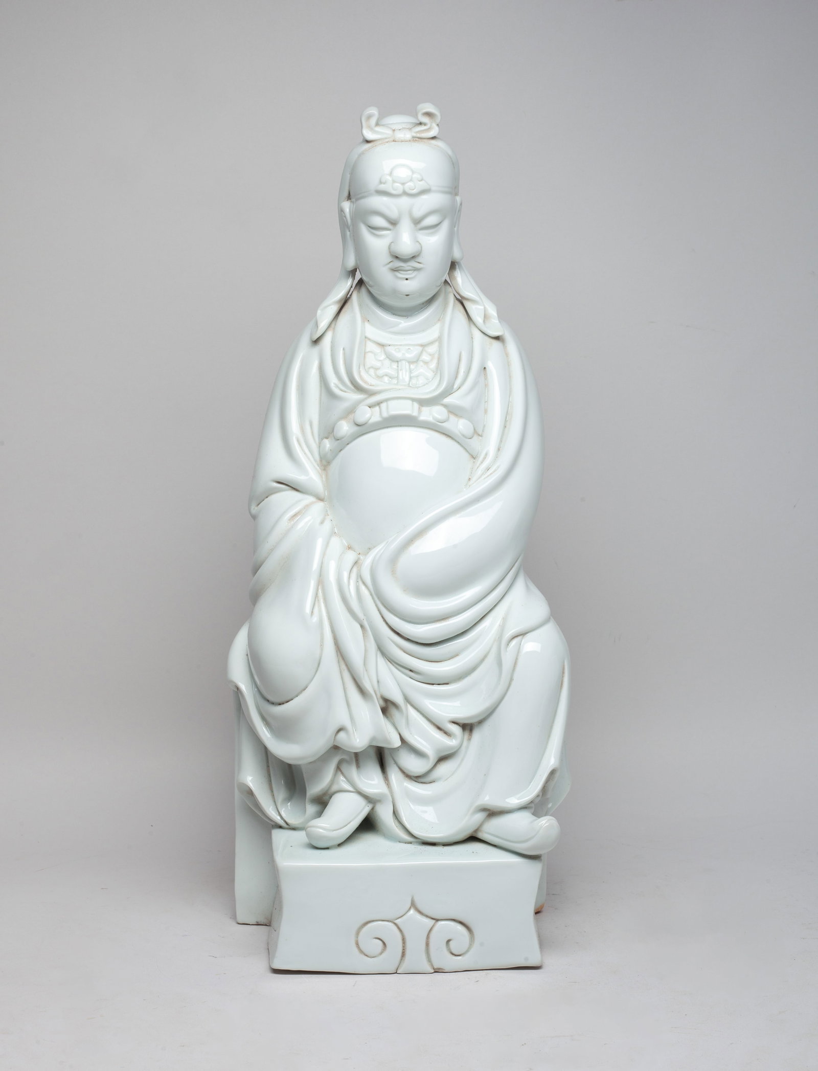 Tall Chinese Blanc De Porcelain Sculpture: Chinese porcelain sculpture moulded in form of a seated scholar, wearing a long flowing robe and a hair tie, the exterior applied with even white glaze. Approx. 17.7*6.7*6.2 inch.