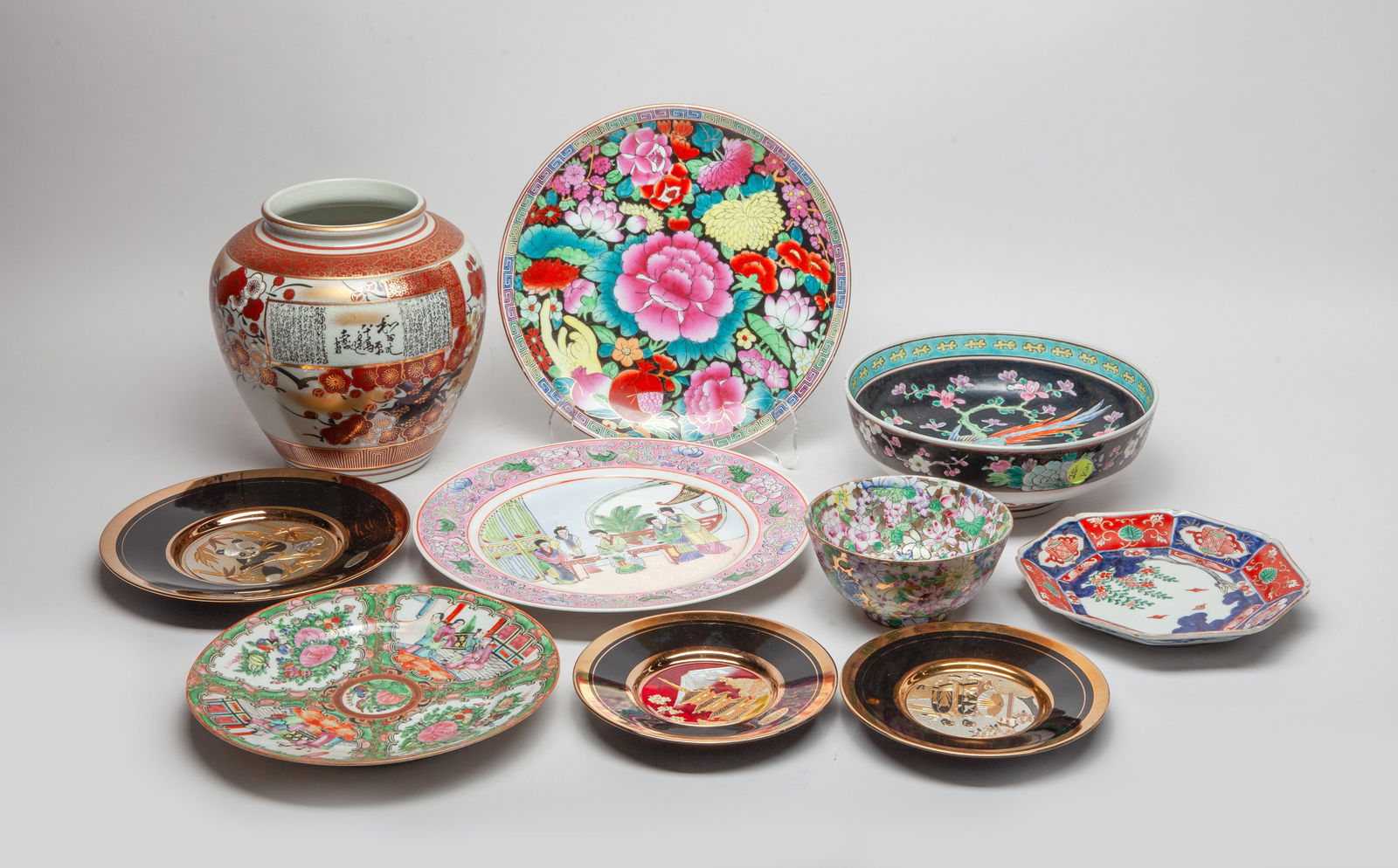 Estate Set Chinese, Japanese Porcelains: Including a jar, two bowls and seven plates, decorated with flowers, figures, birds or pandas. Size varies.
