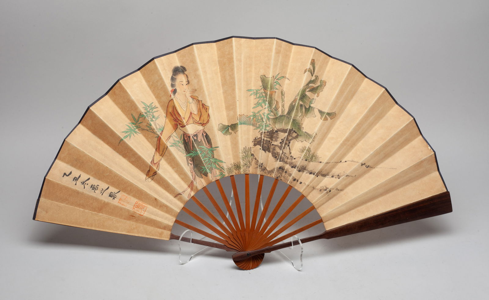 Chinese Export Painted Fan: Chinese export fan, painted on one side with a lady amidst bamboo, plantain leaves and rocks, the reverse inscribed with related poems. Approx. 24*13 inch.