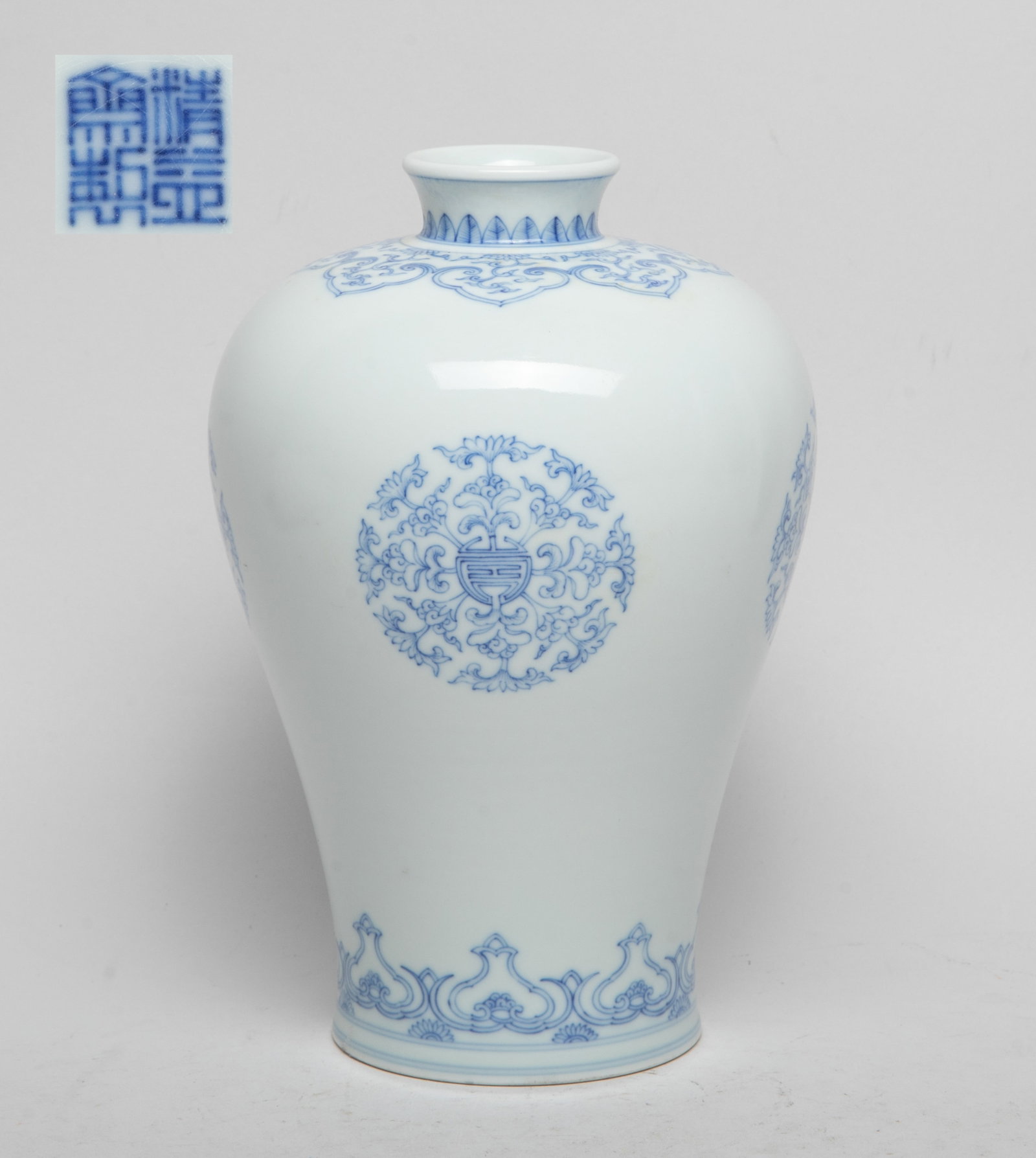 Chinese Export Blue & White Porcelain Vase: Of baluster form, the exterior decorated with stylized foliage forming in circular shapes, under a band of ruyi heads enclosing foliate scrolls, above a band of stylized flowers, the bottom with a fou