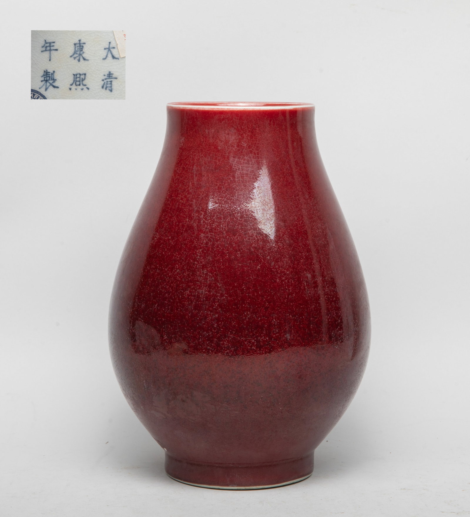 Chinese Red Glazed Porcelain Vase: The vase exterior and interior neck applied with crackled and bubbled dark red glaze, marked with six characters on crackled white glazed base. Approx. 10.3*7.2 inch.