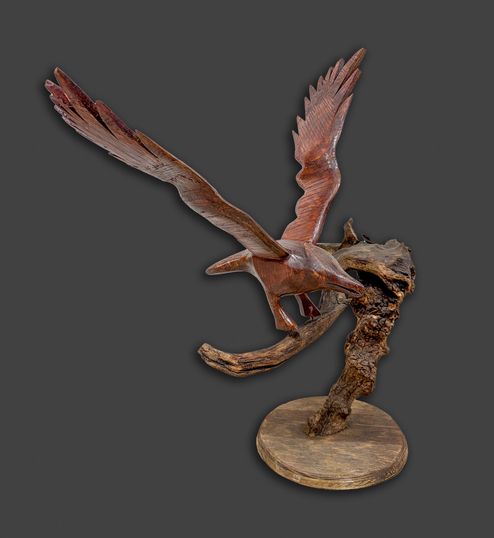 Vintage Folk Art Wood Sculpture: Room decor contemporary art style wood sculpture, carved as a bird on a branch with wings outstretched. Approx. 25.5*24*12 inch.
