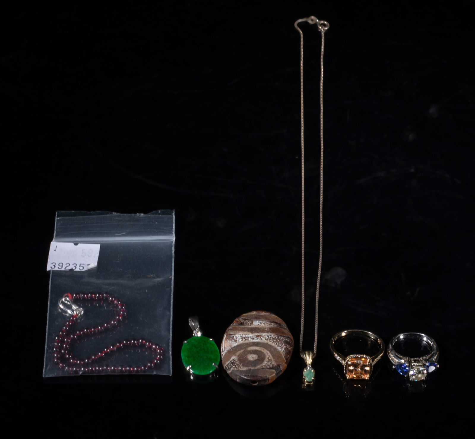 Chinese Jade, Stone, Sterling Jewelry Sets: Including two rings marked 925, a chain necklace marked 925, a bead bracelet, a pendant, and a stone carving. Approx. 18 inch L (necklace size).