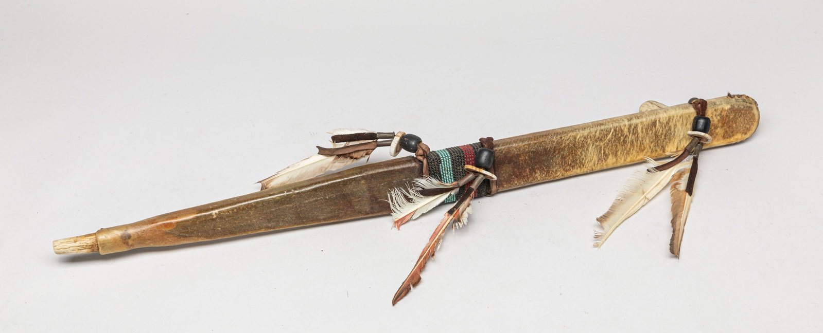 Native American Pipe: Large Native American pipe, decorated with beads and feather. Approx. 25.5*2.8*2.1 inch.