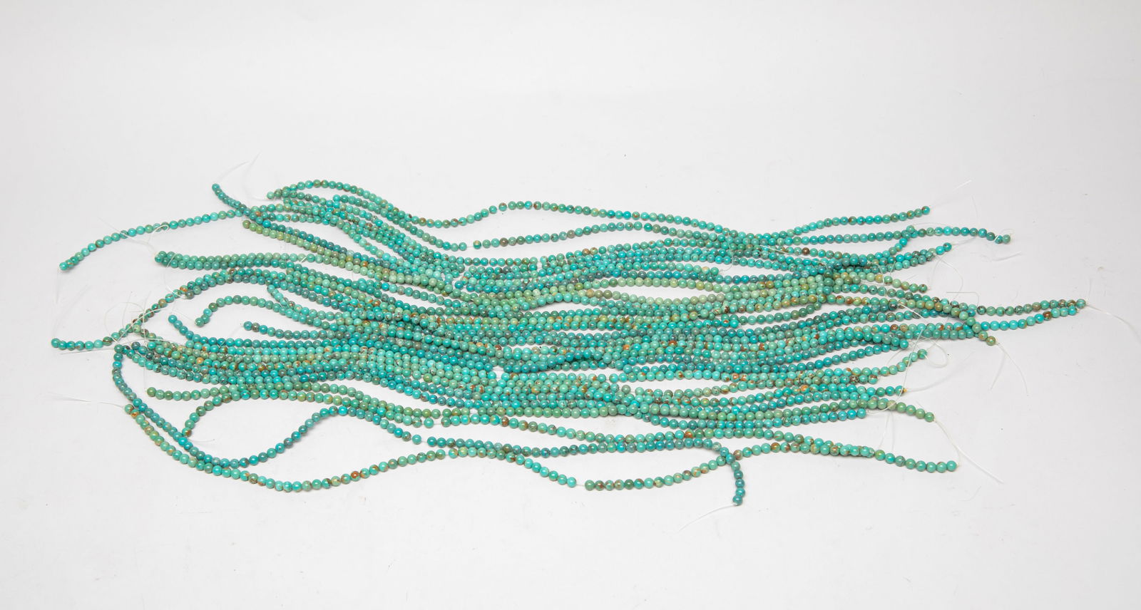 Groups Turquoise Beads Collection: Large group of turquoise carved beads. The length is approximately 14-16 inches.