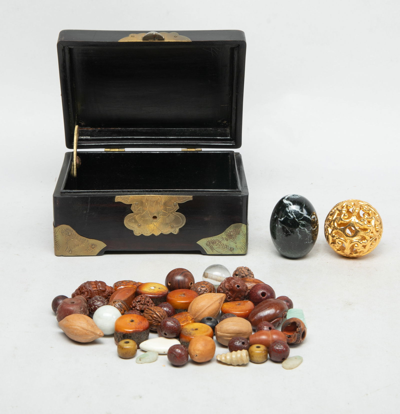 Box of Chinese Export Beads Collections: Box of Chinese export beads, comprised of stone, seed, glass, wood, bone, and decor beads. Approx. 5.4*3.9*2.7 inch (box size). The Estate of the Consignment Store Moving Sale, Pal Springs, 2023.