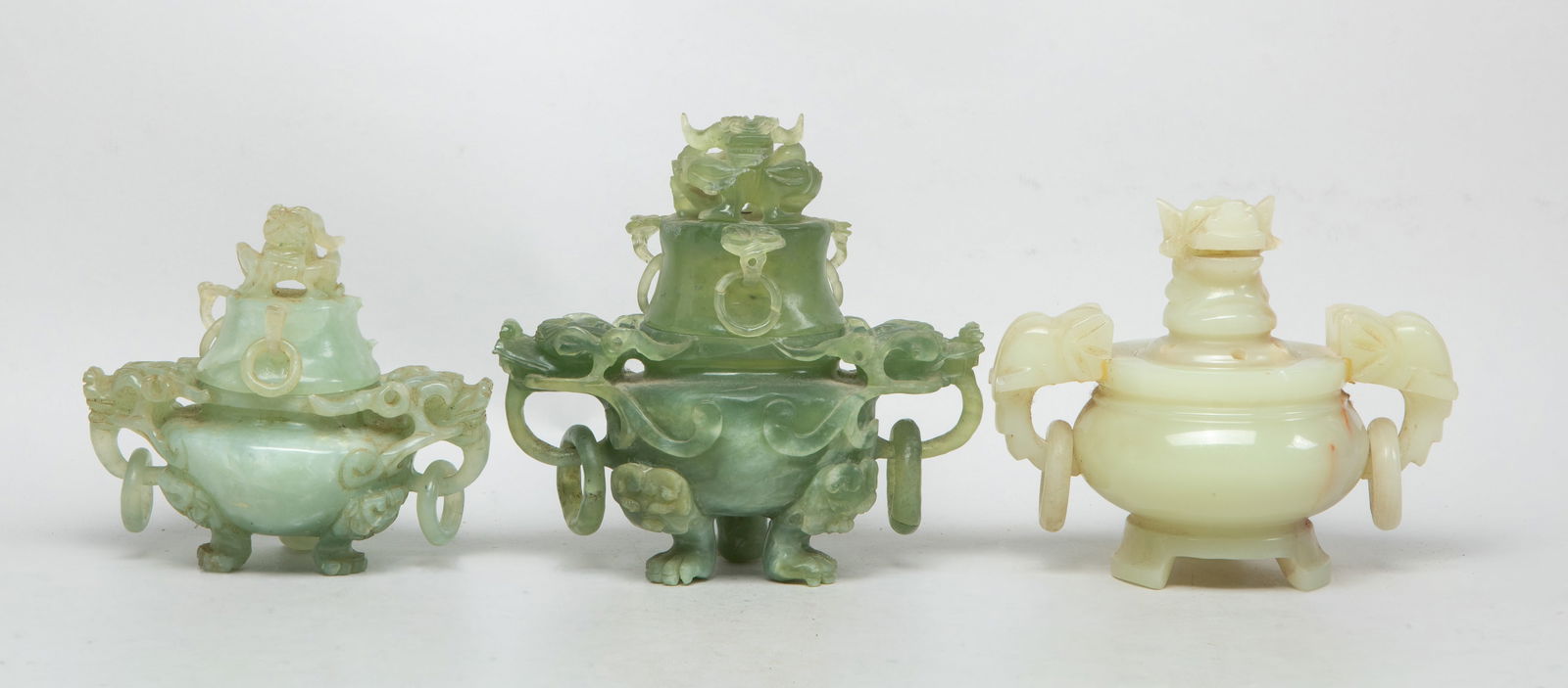 Estate Chinese Export Jade/ Stone Censers: Set of three Chinese jade / stone censers, each carved with a pair of dragon or beast head form handles suspended with loops, the lid surmounted with a dragon or beast form finial. Approx. 6.1*6.3*3.6