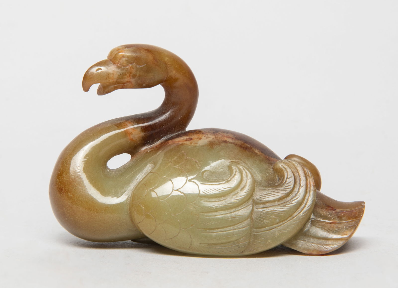 Rare Chinese Russet Jade Sculpture of Goose: Collectible Chinese russet jade carved goose sculpture, the curled neck and head slightly turned to the left, the legs and webs tucked underneath the body. Approx. 3.15*1.45*2 inch.