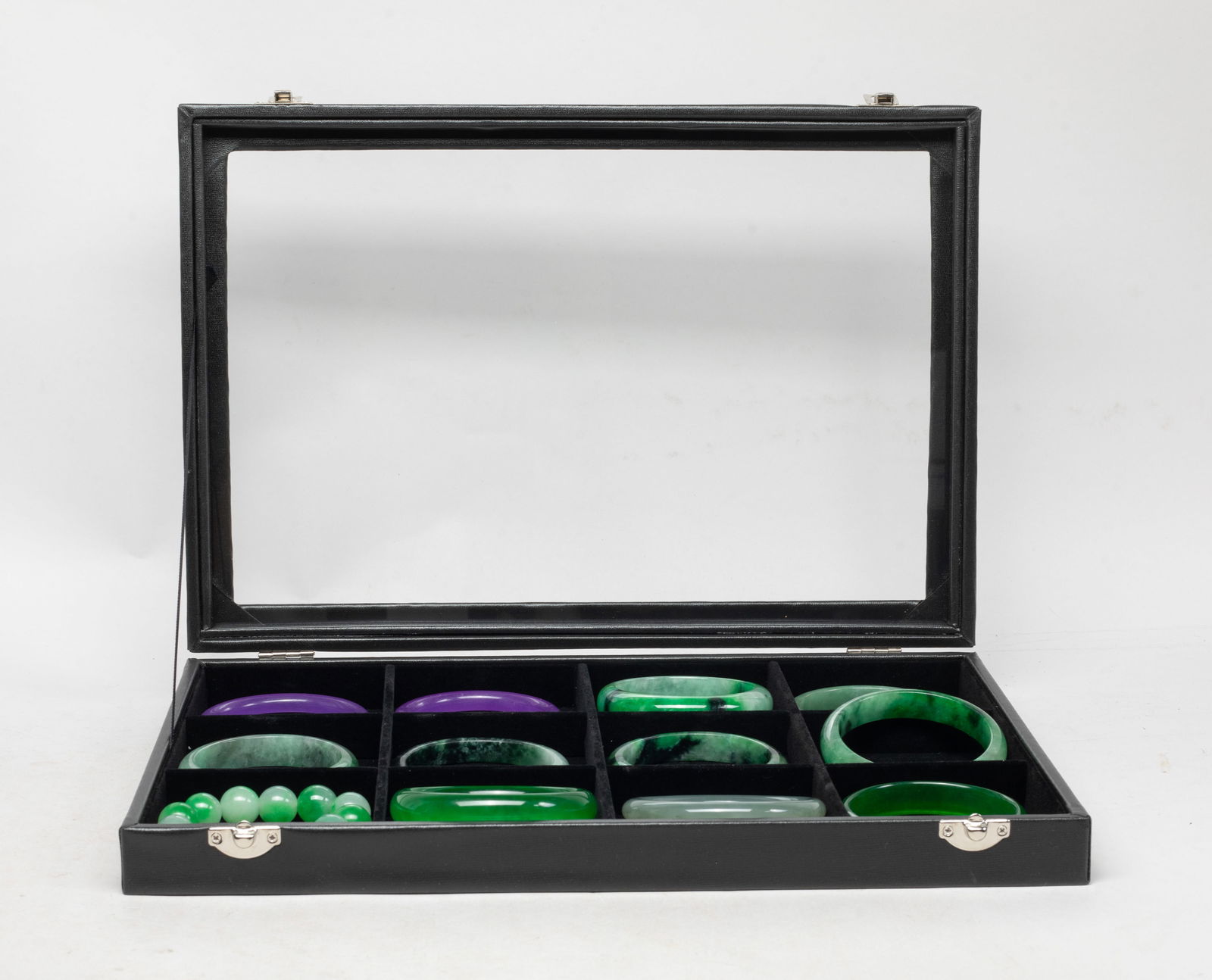 Estate Set of Chinese Colored Stone Bangles, Beads: Set of 11 Chinese colored stone bangles and a bead bracelet, with case. Approx. 3.07 inch outer diameter, 2.42 inch inner diameter (largest bangle).