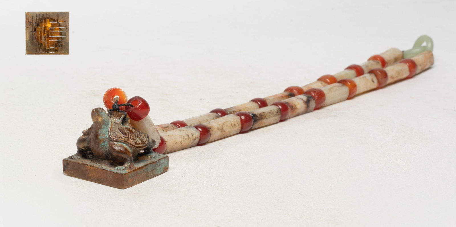 Chinese Jade, Agate Necklace w/ Glass Seal: Chinese russet jade and agate bead necklace, the jade beads incised with ancient characters, with a glass seal surmounted with a turtle. Approx. 21 inch L (necklace size).