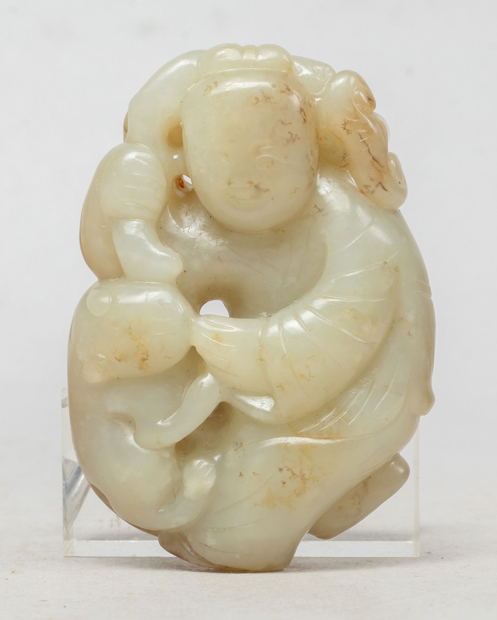 Large Chinese Russet Jade Pendant: Carved and reticulated with a figure holding a gnarled stem issuing lingzhi heads and leaves, a cat clambering on the side. Approx. 2.85*2*0.9 inch.
