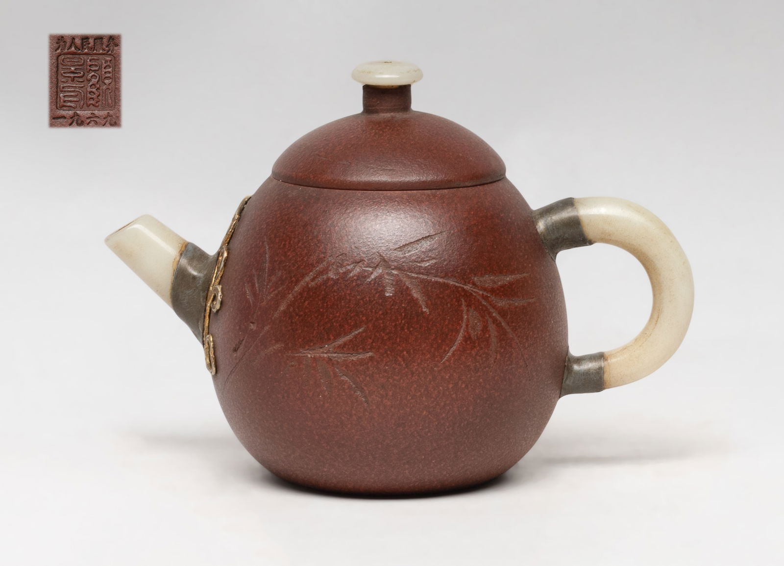 Chinese Export Zisha Clay Tea Pot: The tea pot body incised with bamboo and inscription, with stone handle, spout and lid finial, the lid interior and the pot bottom with marks. Approx. 5.8*4.1*3.5 inch.