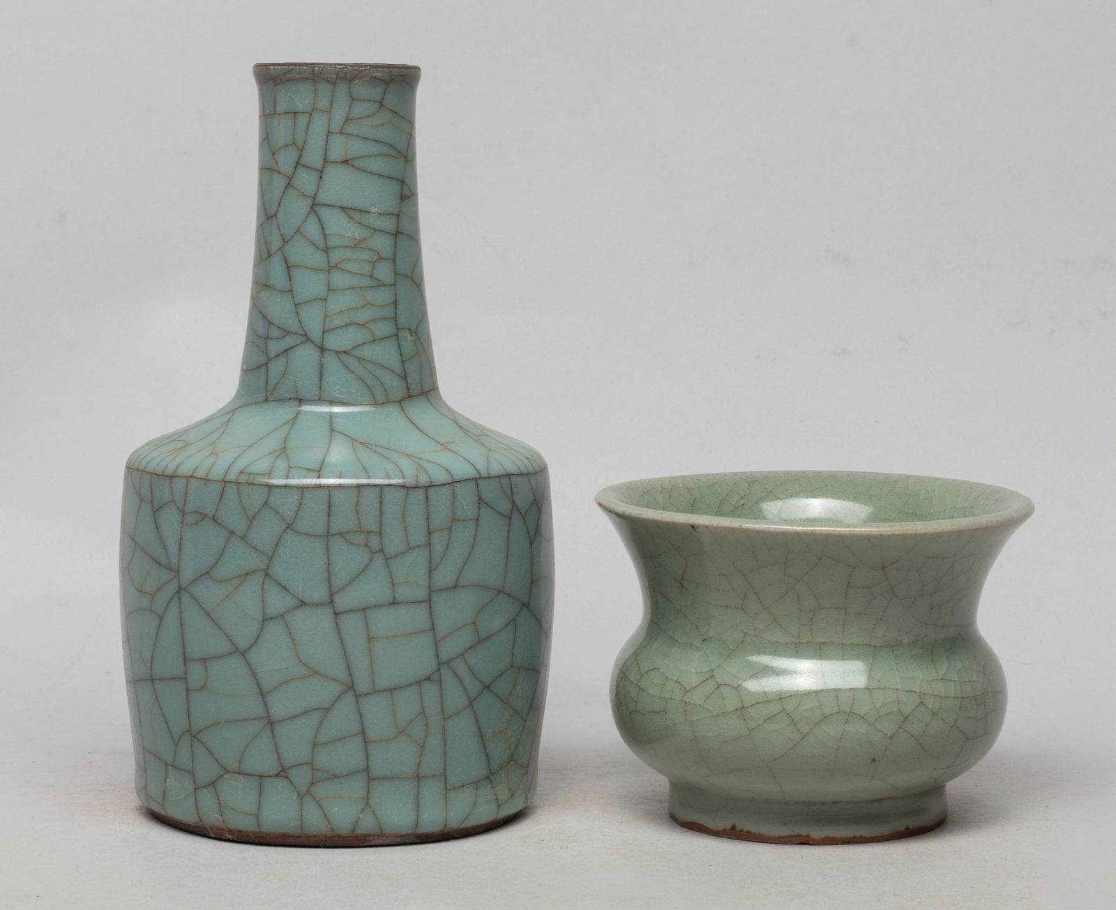 Estate Chinese Porcelain Cabinet Vase, Washer: The vase overall covered with blue-celadon glaze suffused with a matrix of black and brown crackles, the washer covered overall with crackled celadon glaze. Approx. 7*3.9 inch (vase size).