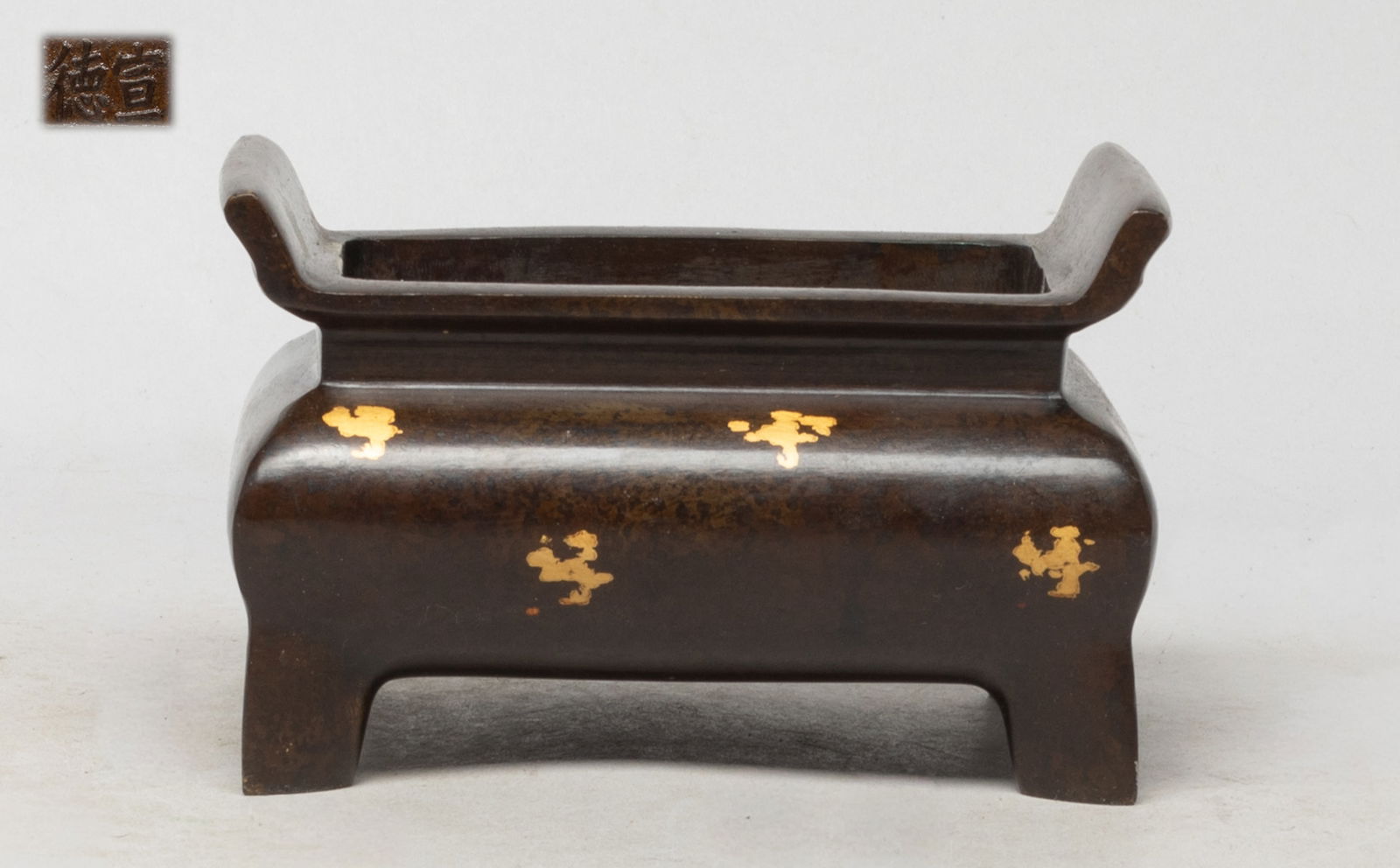 Estate Chinese Bronze Cabinet Censer: Of rectangular section, of chocolate brown patina adorned in splashes of gilt to the exterior surfaces, the bottom inscribed with a two-character mark. Approx. 4.9*3.6*3 inch.
