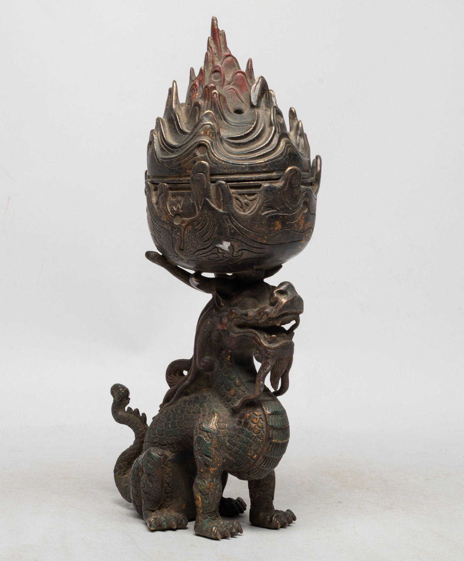 Collectible Chinese Bronze Censer: Cast as a crouching dragon supporting a censer on the head, the censer body incised with two phoenix, the pierced cover formed as a magical mountain. Approx. 11.6*5.3*3.8 inch.