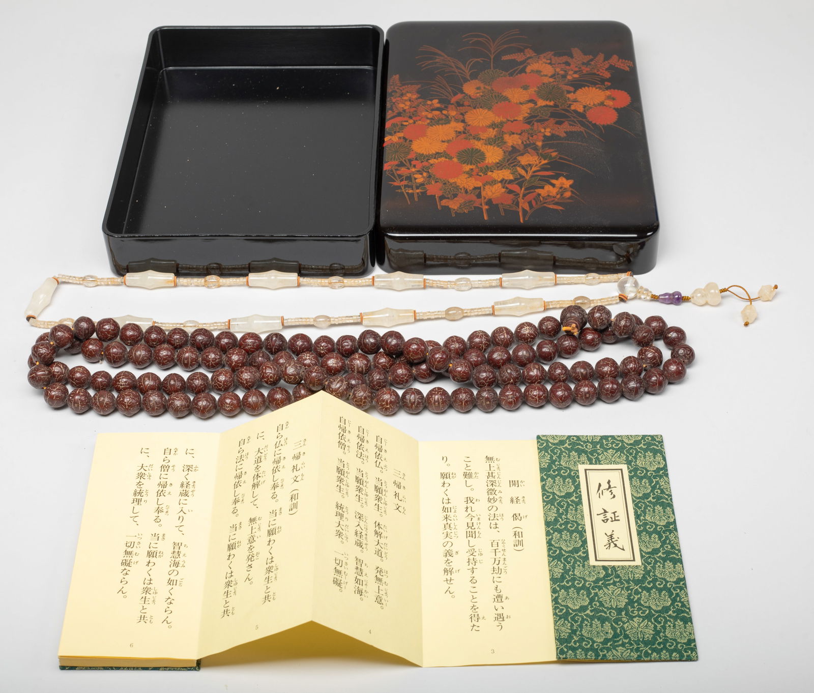 Chinese Export Seed, Crystal, Prayer Beads: Including a long string of seed prayer beads, a crystal necklace, and a Buddhist book, with box. Approx. 62 inch L (longest string size).