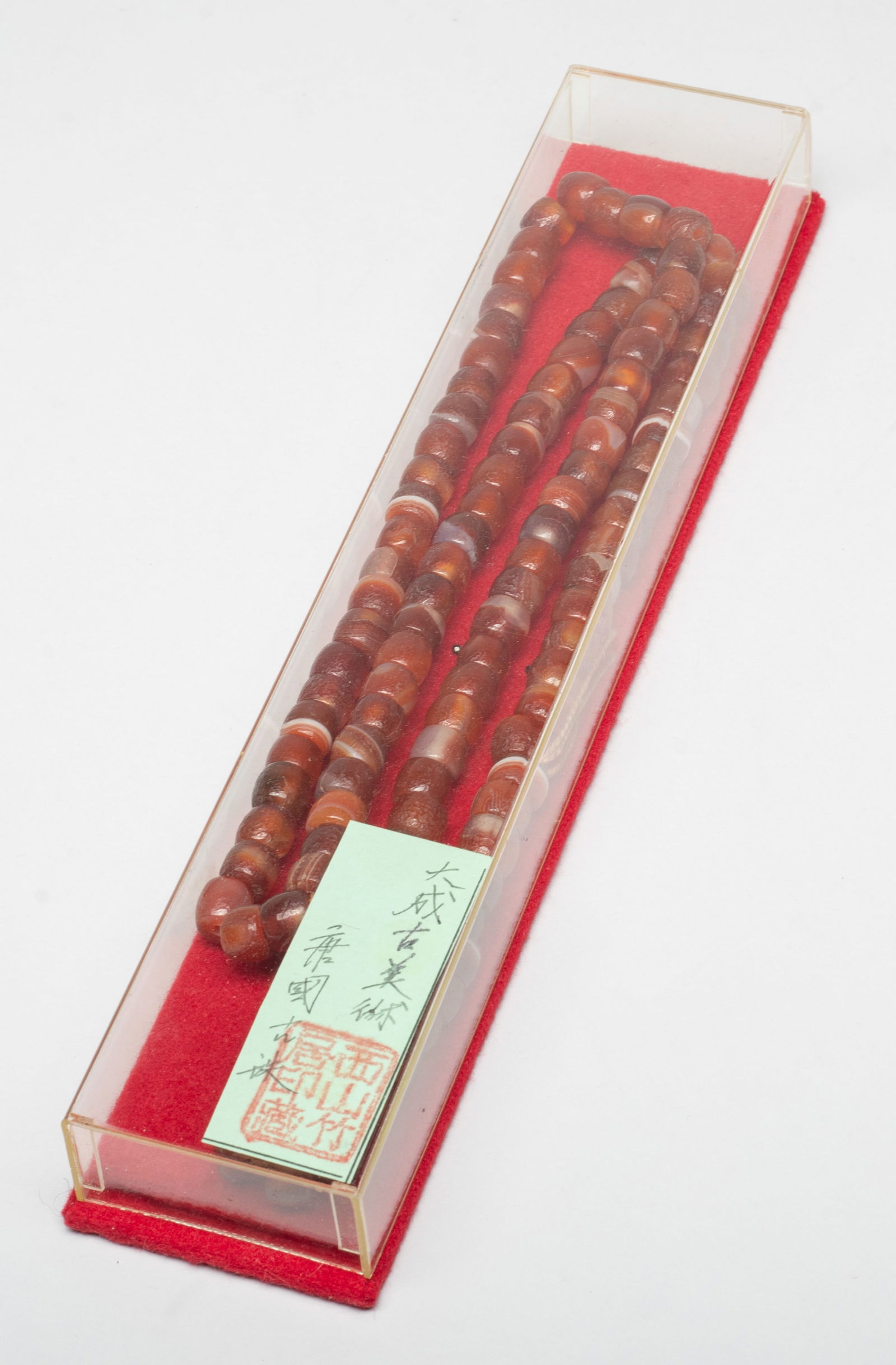 Chinese Cameo Agate Long Necklace: Long Chinese cameo agate bead necklace, with case. Approx. 36 inch L (necklace size). The Estate of the Store Closed Sale, DTLA, 2020.