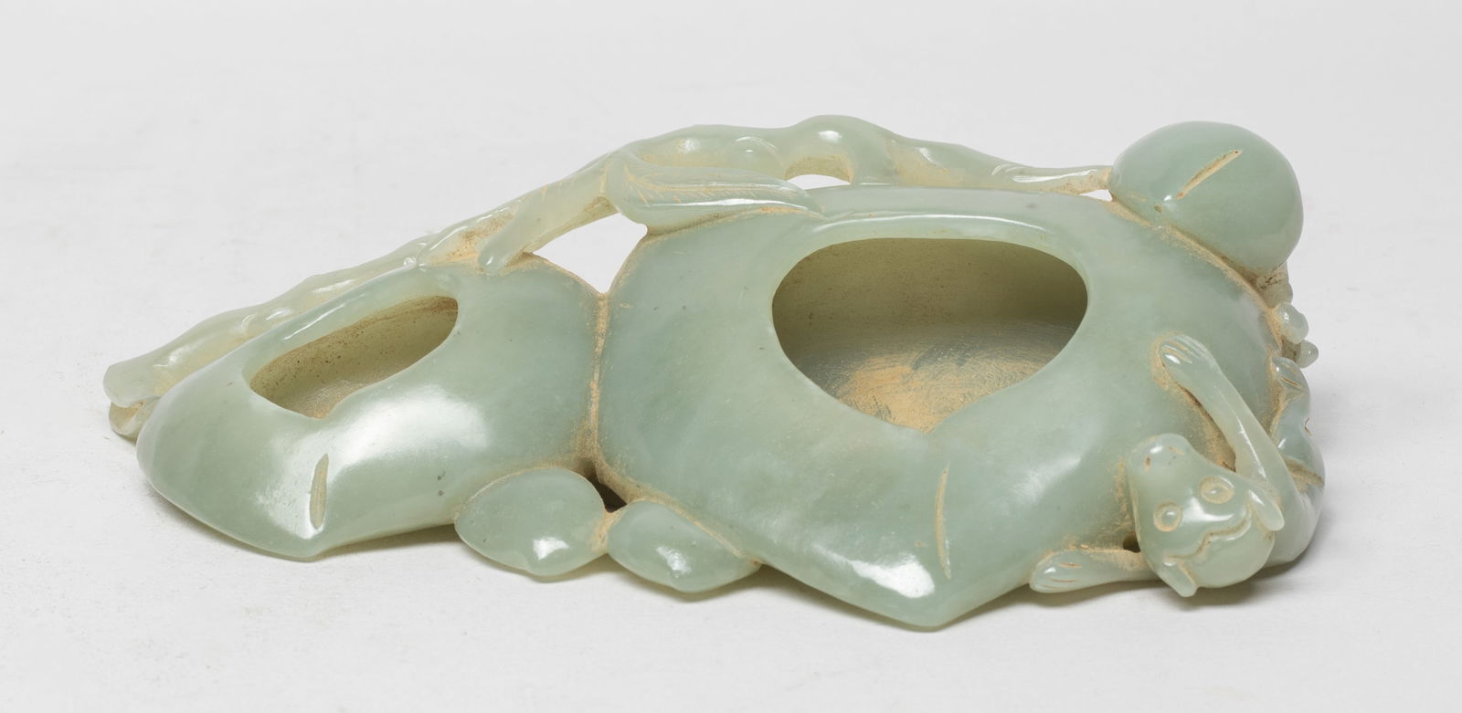 Large Chinese Peach Form Sculpture: Carved in the round as a pair of peaches suspended from entwined branch-work, issuing three smaller peaches, and featuring a monkey clambering on the larger fruit. Approx. 5.9*3.5*1.5 inch.