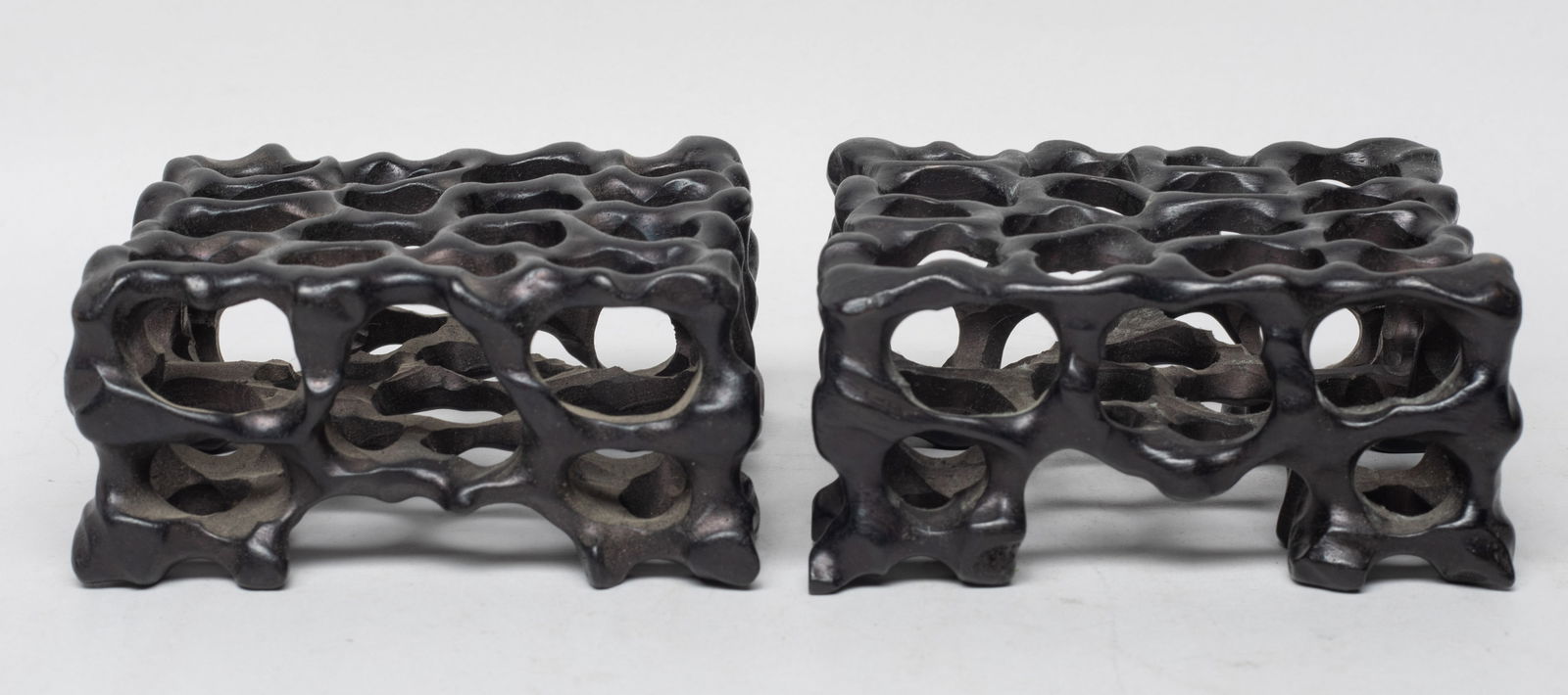 Two Chinese Wood Carved Stands: Two Chinese wood stands carved and reticulated as gnarled branch form. Approx. 3.9*3.8*1.8 inch (each).